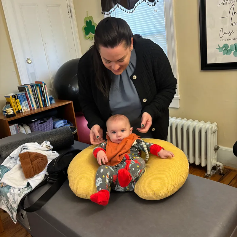 Dr. Desiree Curley providing gentle pediatric chiropractic care at Essential Life Chiropractic in Freehold